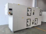 Diagonal oblique front view of FXC series combined desiccant wheel dehumidifier with integrated PLC touch control cabinet, manufactured by Zhejiang Fengxing factory for food, pharmaceutical and glass low humidity production line